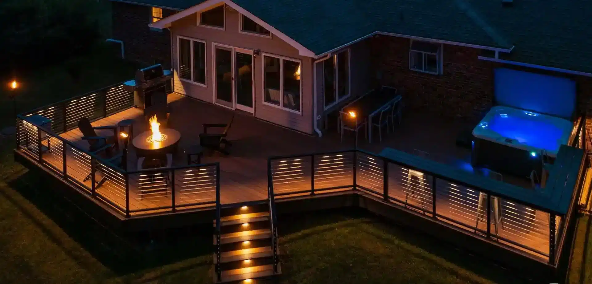  custom deck with cable railing, deck light, and in-step lighting