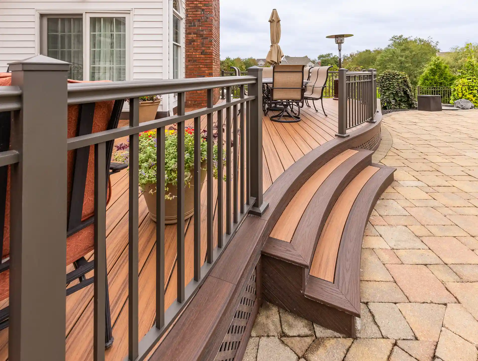 Photo of a composite deck with slight curves in the deck and the steps.