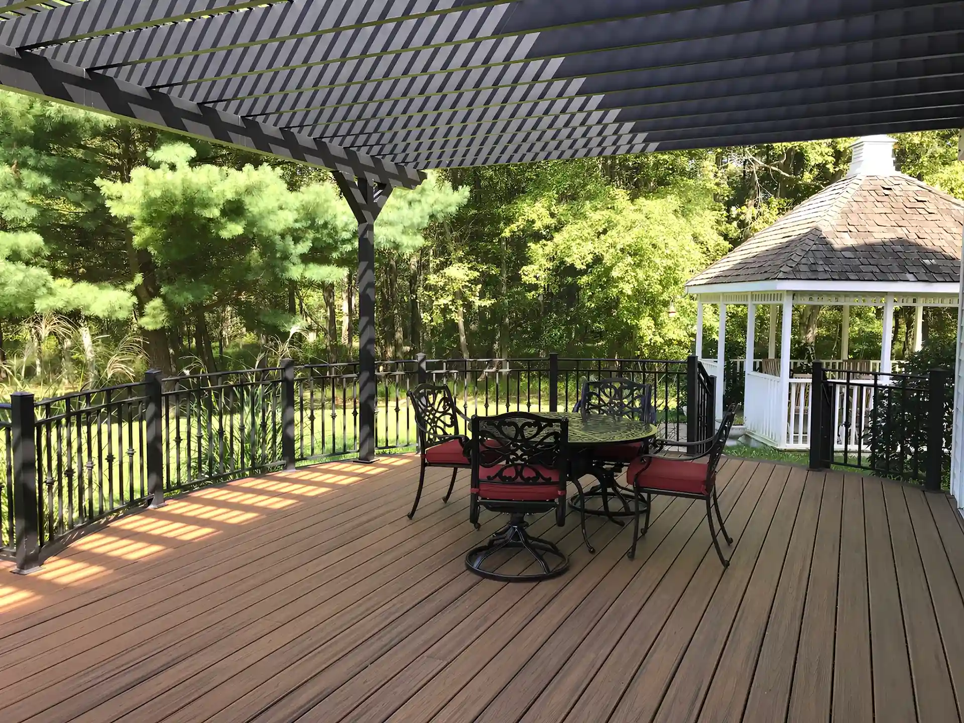 Photo of a pergola providing cover for a deck.