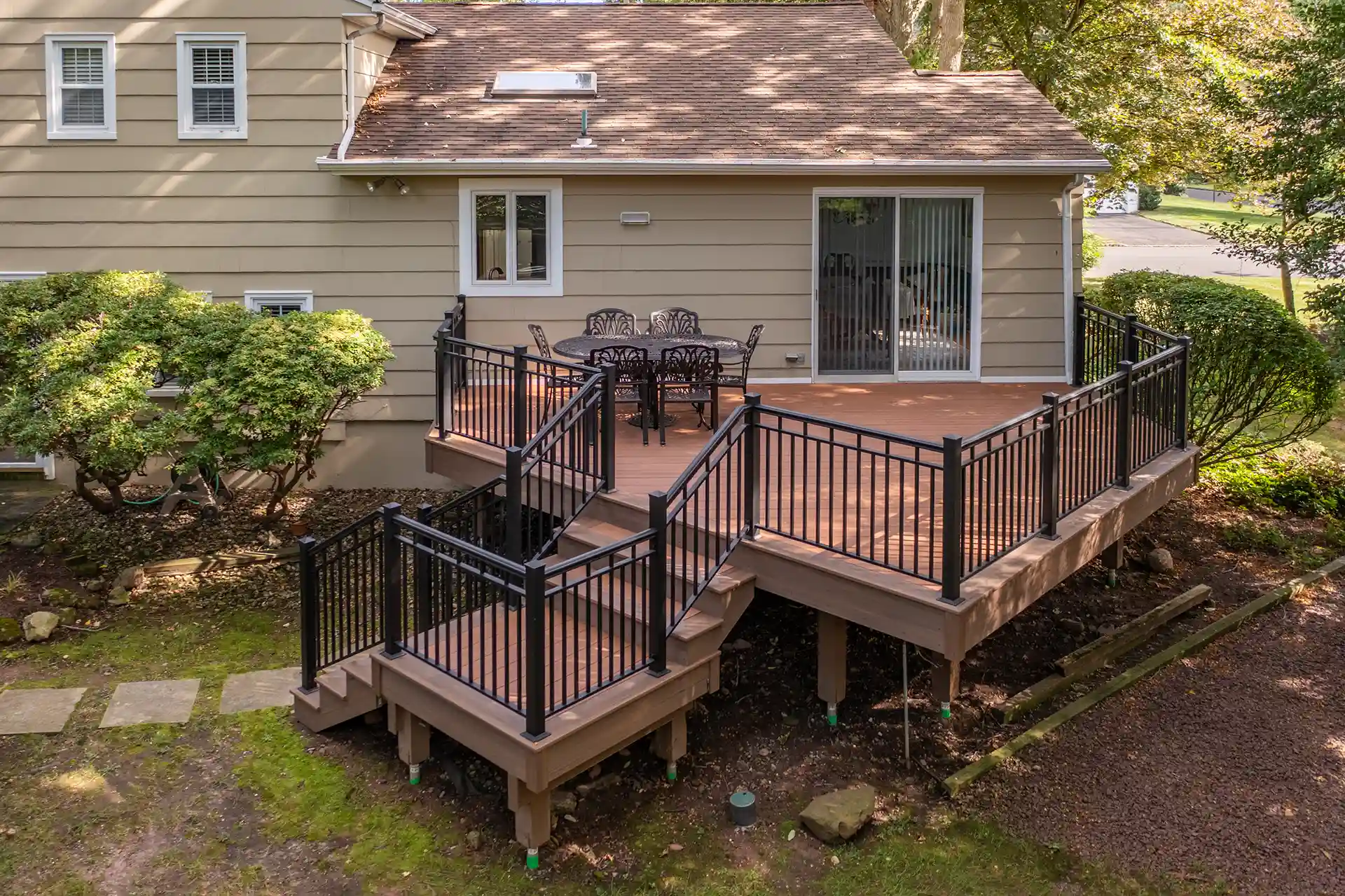 Deck safety tips for children Photo of a deck with railing and deck steps by My Deck, a deck builder that helps homeowners understand child deck safety in New Jersey.