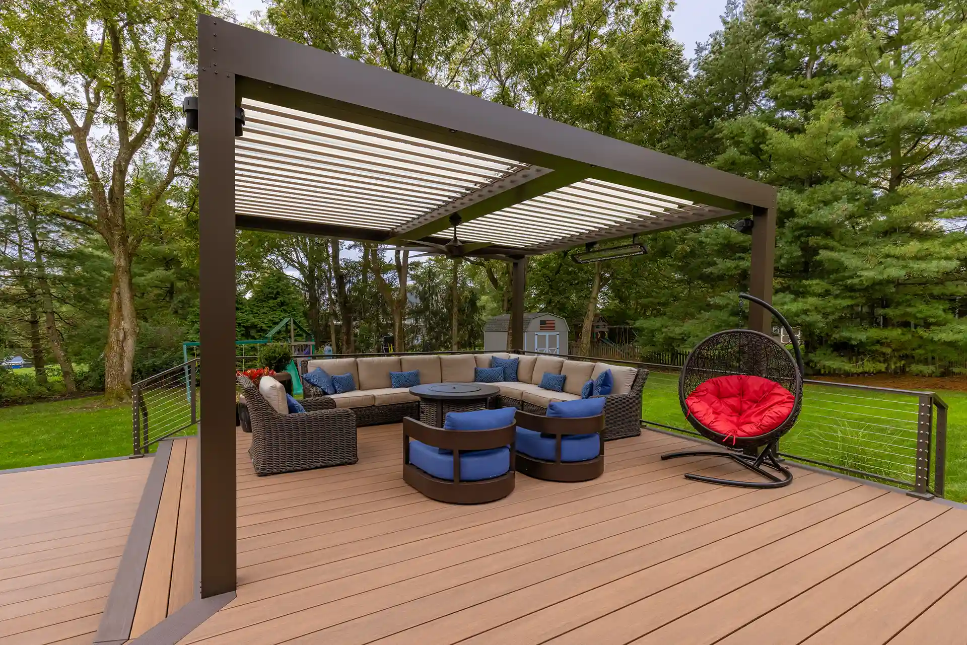 best composite decking Photo of a deck with AZEK advanced PVC decking with pergola and outdoor furniture.